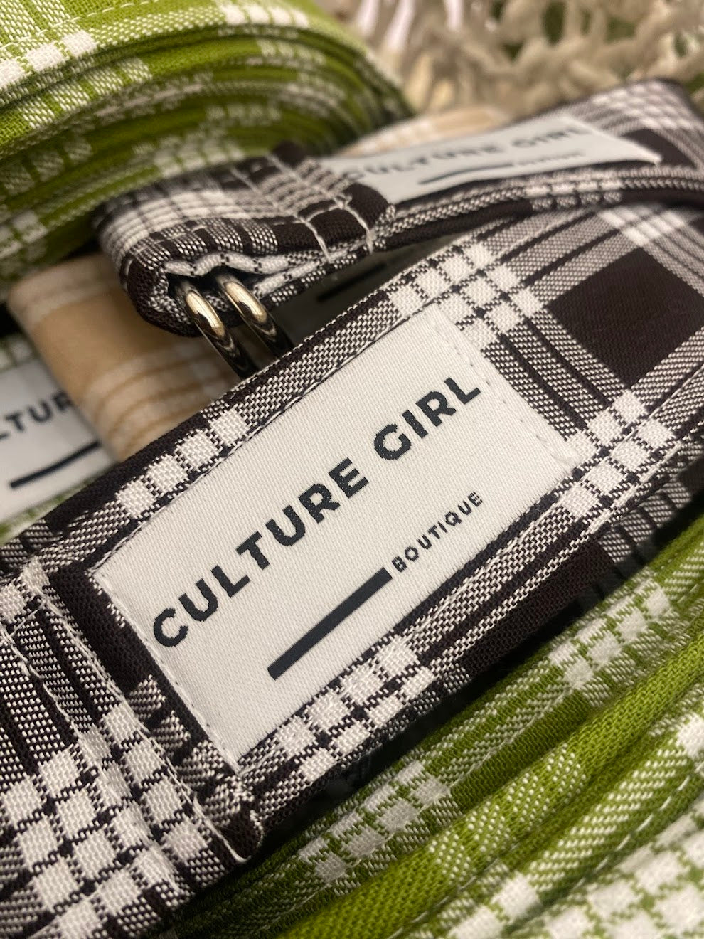 Palaka fabric with 'Culture Girl Boutique' label belts