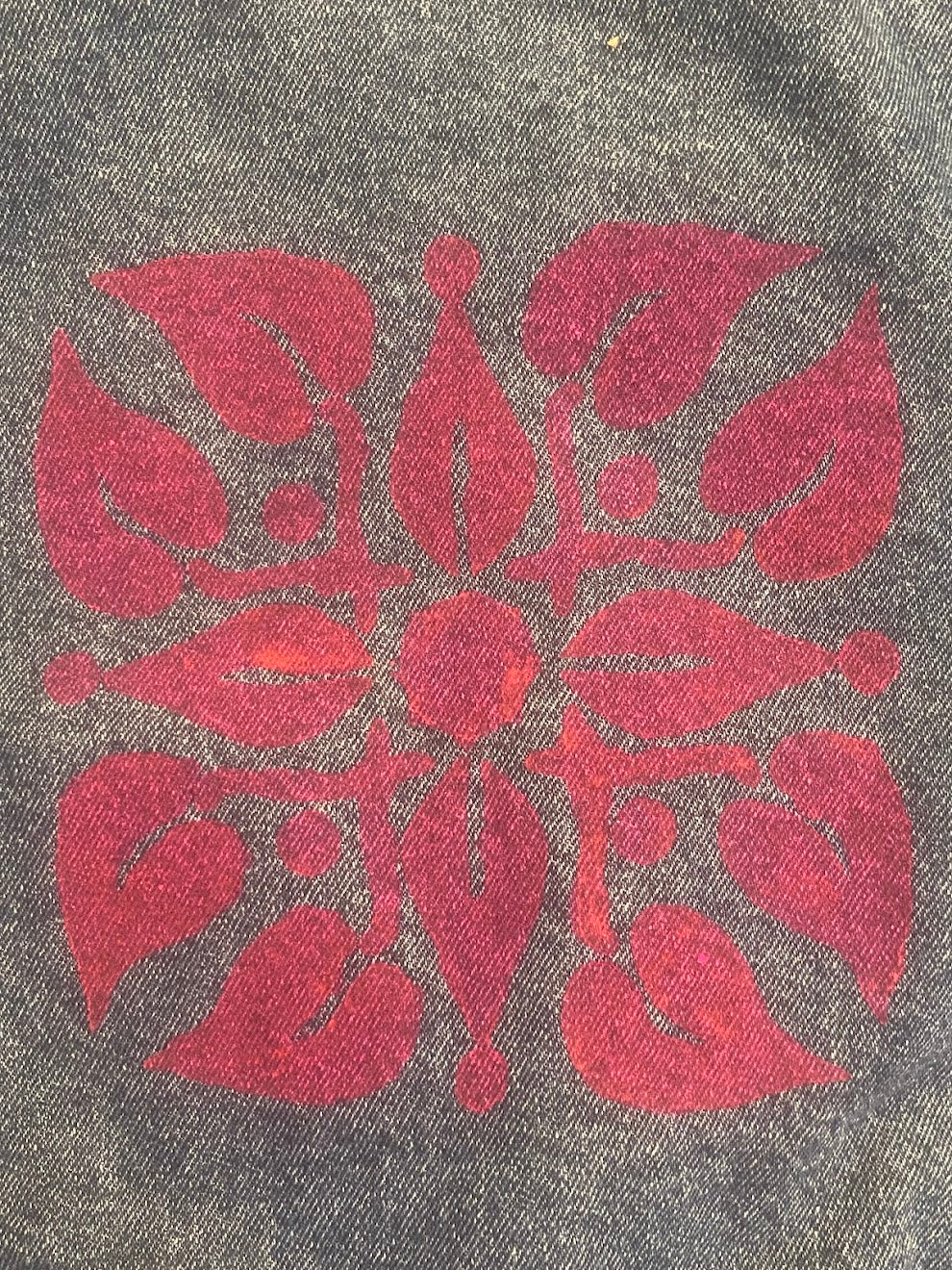 Culture Girl Boutique hand-painted ulu print design on denim jacket close up