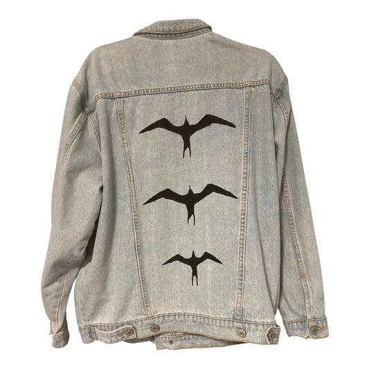 Hand-painted Black Iwa Bird on light-wash upcycled denim jacket crafted in Hawai‘i by Culture Girl Boutique