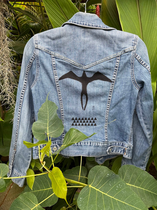Light washed denim jacket black Iwa bird and lokahi triangle design hand-painted by Culture Girl