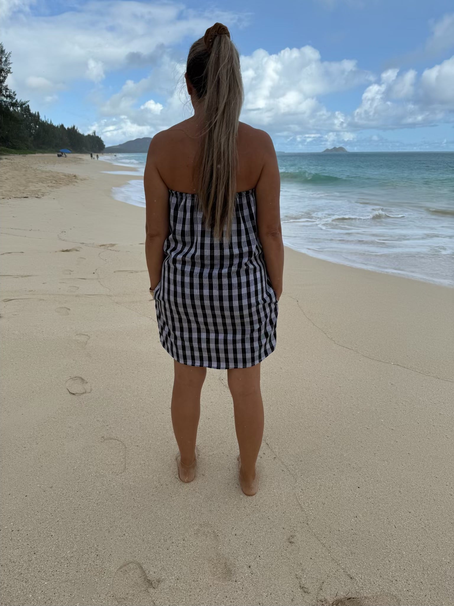 Back view of Culture Girl Boutique owner wearing black palaka strapless dress