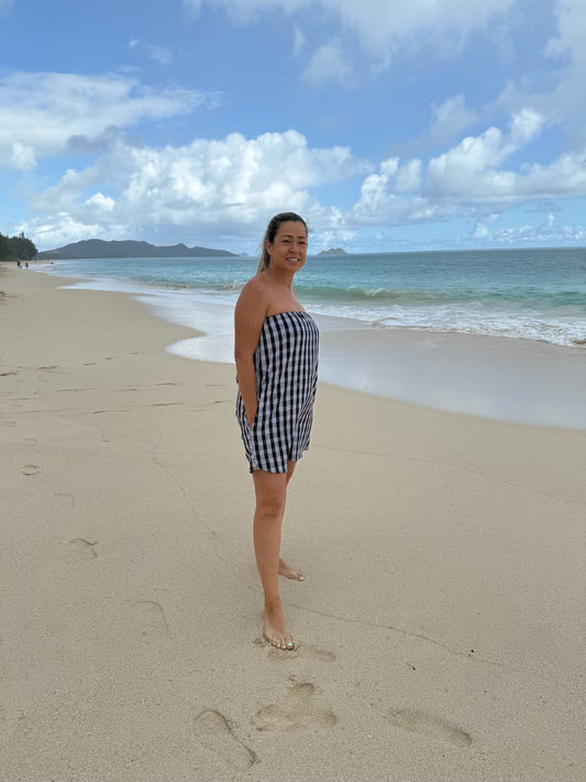 Side view of Culture Girl Boutique owner wearing black palaka strapless dress