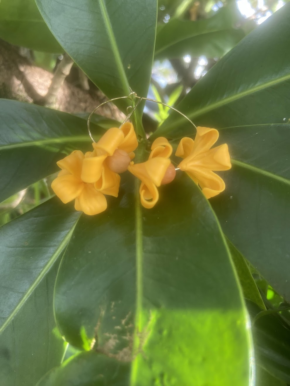 Culture Girl handmade, clay yellow puakenekene hoop earrings