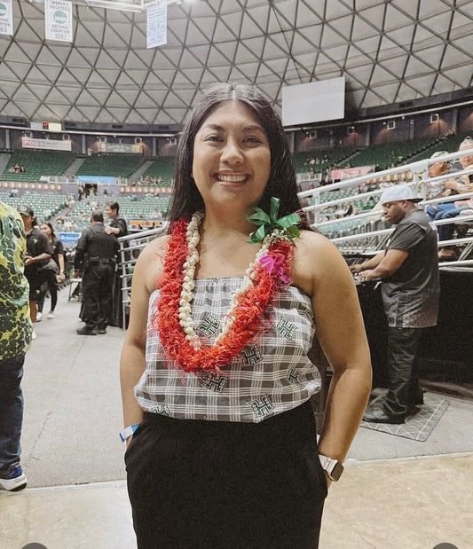 Model wearing University of Hawaii licensed logo pattern on gray palaka print strapless tube top