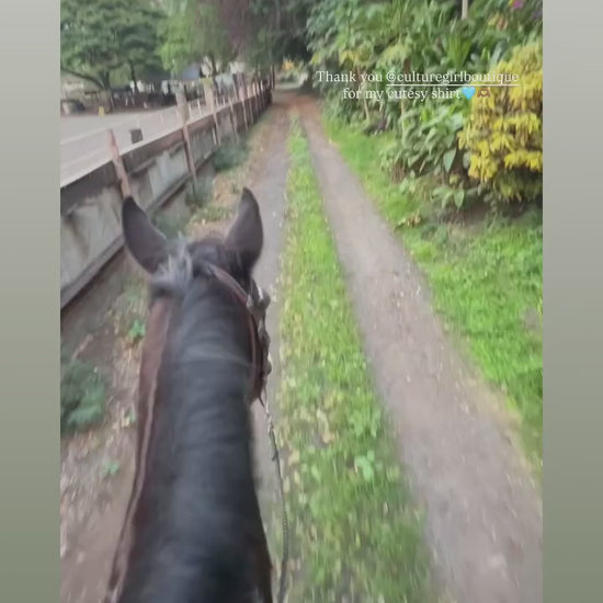 Model wearing Culture Girl light blue denim button down jacket with Hawaiian Ulu print design